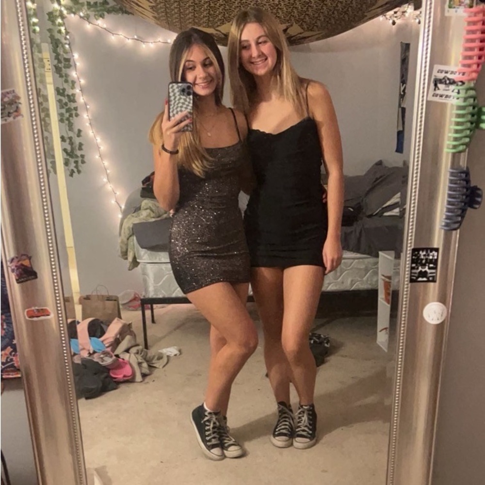 (Dress on the left) Black sparkly short homecoming dress from Windsor